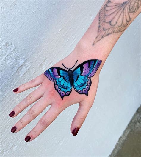 butterfly tattoo on hand|Butterfly Hand Tattoo Meaning and Symbolism: Fully。